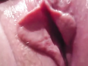 Stimulating her pink clit in close up video
