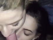 One big cock and two girls taking care of it