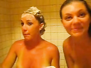 Two happy girls showering together